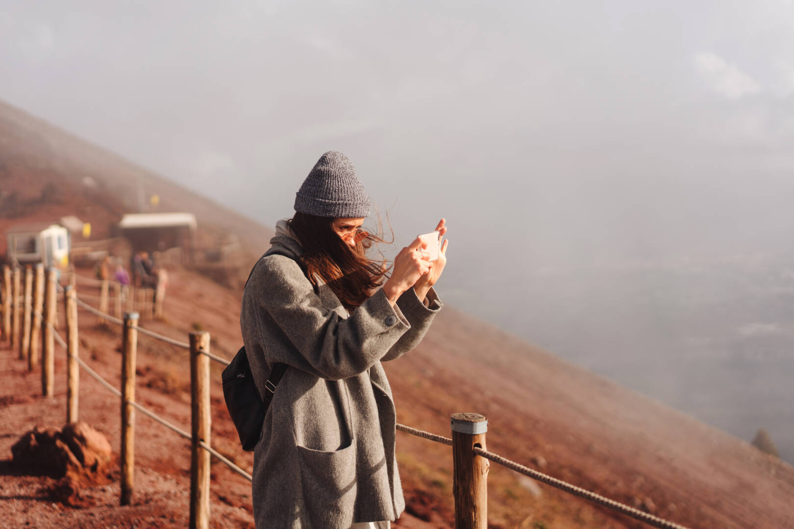 Girl climbs the path to the mountain